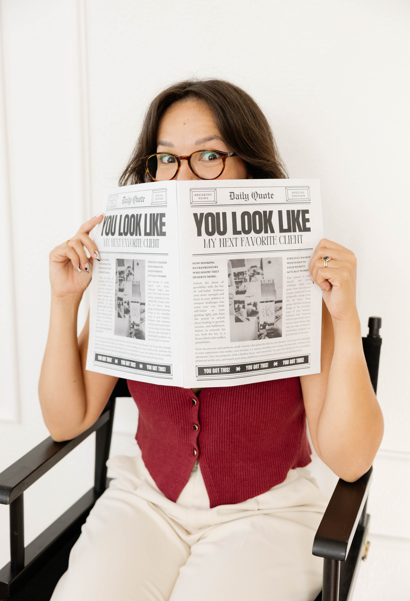 Nathalia holding Viksen Creative newspaper